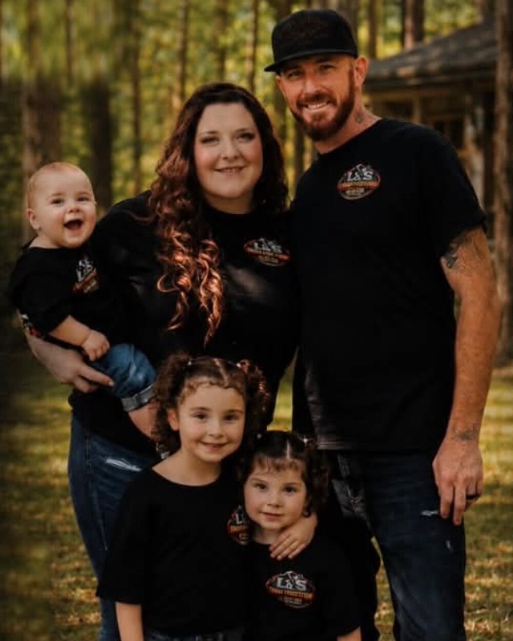 The L&S Construction family — the owners with their three children — outdoors in Central Illinois