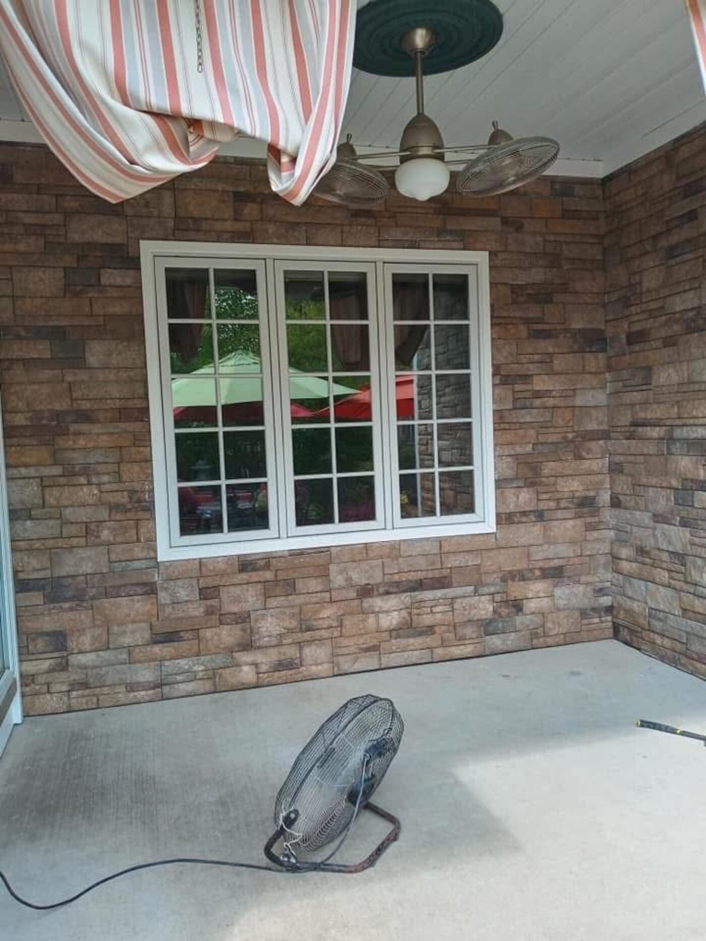 Close view of finished stacked-stone porch wall